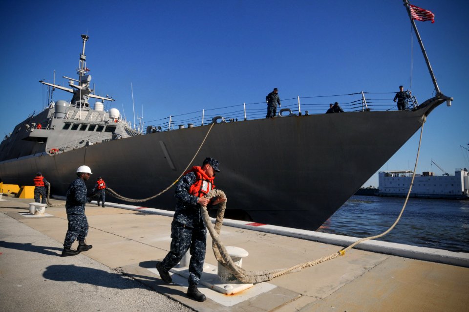 US Navy 100216-N-1522S-004 Sailors handle lines as the littoral combat ship USS Freedom (LCS 1) departs Naval Station Mayport for its first operational deployment