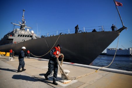 US Navy 100216-N-1522S-004 Sailors handle lines as the littoral combat ship USS Freedom (LCS 1) departs Naval Station Mayport for its first operational deployment