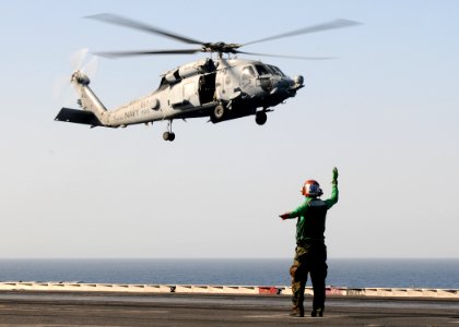 US Navy 100216-N-4236E-032 A Sailor directs the landing of an HH-60H Sea Hawk helicopter assigned to the Nightdippers of Helicopter Anti-Submarine Squadron (HS) 5