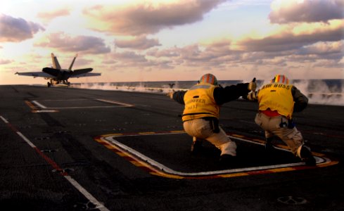 US Navy 100211-N-2858S-303 Cmdr. Bob Cady, right, and Lt. Alonzo Wynn launch an F-A-18E Super Hornet aboard the Nimitz-class aircraft carrier USS Harry S. Truman (CVN 75)