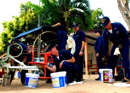 US Navy 100216-N-6692A-016 Sailors assigned to USS Harpers Ferry (LSD 49) repair and paint a children's playground during a community service project at Bann Yai Ra Children Development Center