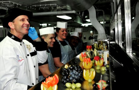 US Navy 100216-N-3595W-021 Vice Chief of Naval Operations (VCNO) Adm. Jonathan W. Greenert serves dinner to the crew of the aircraft carrier USS Dwight D. Eisenhower (CVN 69)