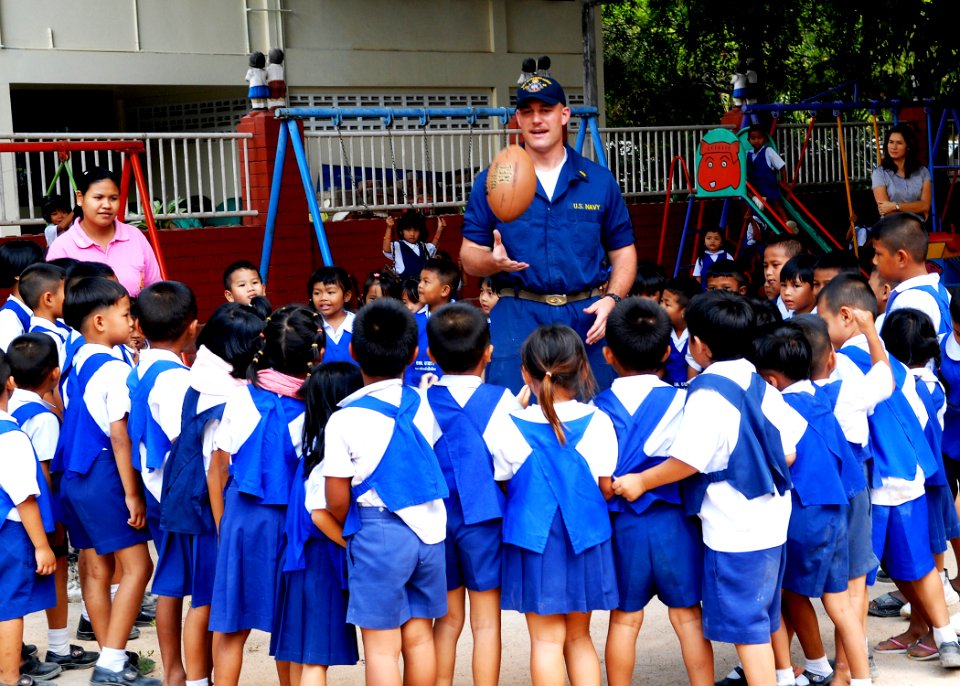 US Navy 100216-N-6692A-045 Ens. Joshua Priebe plays with school children at Bann Yai Ra Children Development Center during a community service project