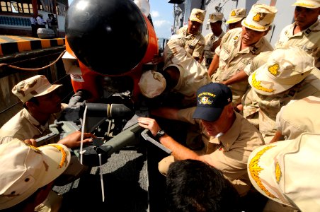 US Navy 100216-N-8335D-074 Chief Mineman William Brown shows Royal Cambodian Navy officers a mine-neutralization vehicle aboard the mine counter-measures ship USS Patriot (MCM 7)