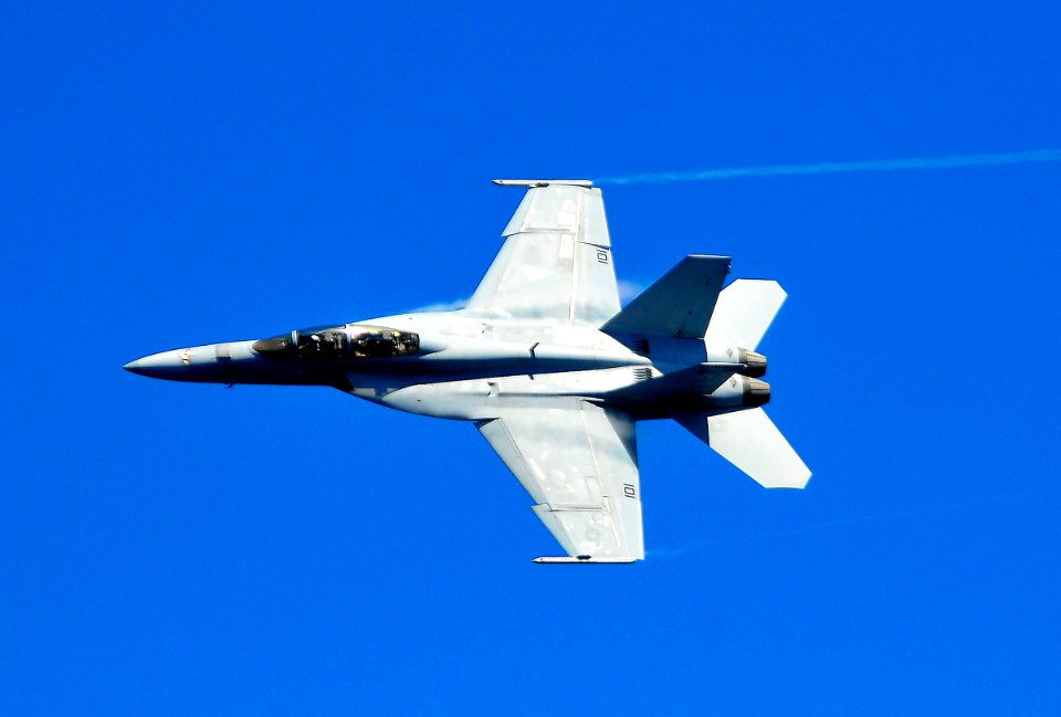 US Navy 100216-N-4774B-741 An F-A-18F Super Hornet flies near USS Carl Vinson (CVN 70)