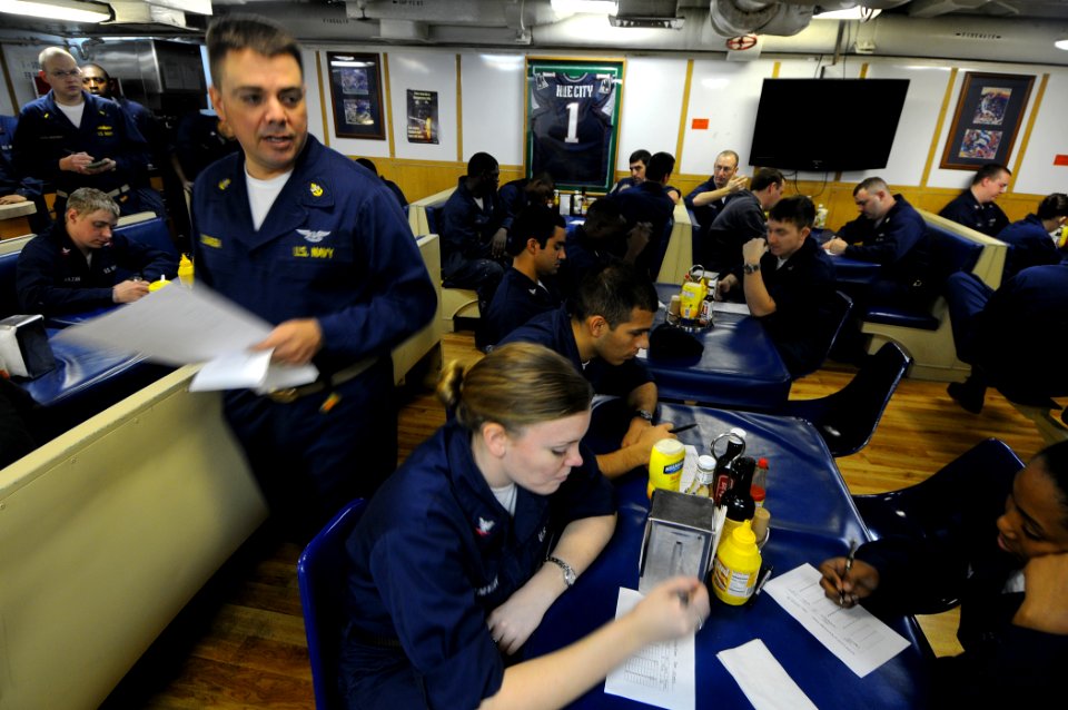 US Navy 100213-N-1688B-083 Chief Master-at-Arms Anthony Sganga administers an in-port security watch qualification test to sailors aboard the guided-missile cruiser USS Hue City (CG 66)