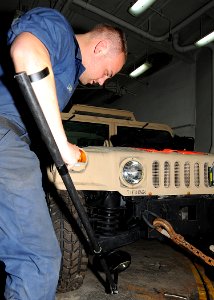 US Navy 100213-N-1082Z-032 Seaman D.J. Lane, from Indianapolis, uses a mirror to conduct a mock vehicle inspection during anti-terrorism force protection training aboard the amphibious dock landing ship USS Ashland (LSD 48)