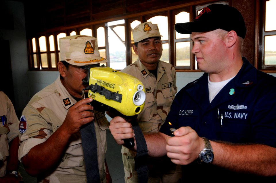 US Navy 100217-N-8335D-028 Damage Controlman 2nd Class Titan Brockopp shows a Royal Cambodian Navy officer how to use a navy infrared thermal imager