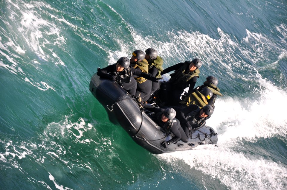 US Navy 100213-N-6199O-098 Soldiers from the Japanese Ground Self-Defense Force prepare to land a combat rubber reconnaissance craft in the well deck of the amphibious transport dock ship USS New Orleans (LPD 18)