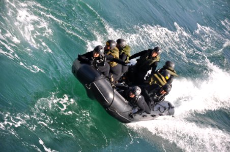 US Navy 100213-N-6199O-098 Soldiers from the Japanese Ground Self-Defense Force prepare to land a combat rubber reconnaissance craft in the well deck of the amphibious transport dock ship USS New Orleans (LPD 18)