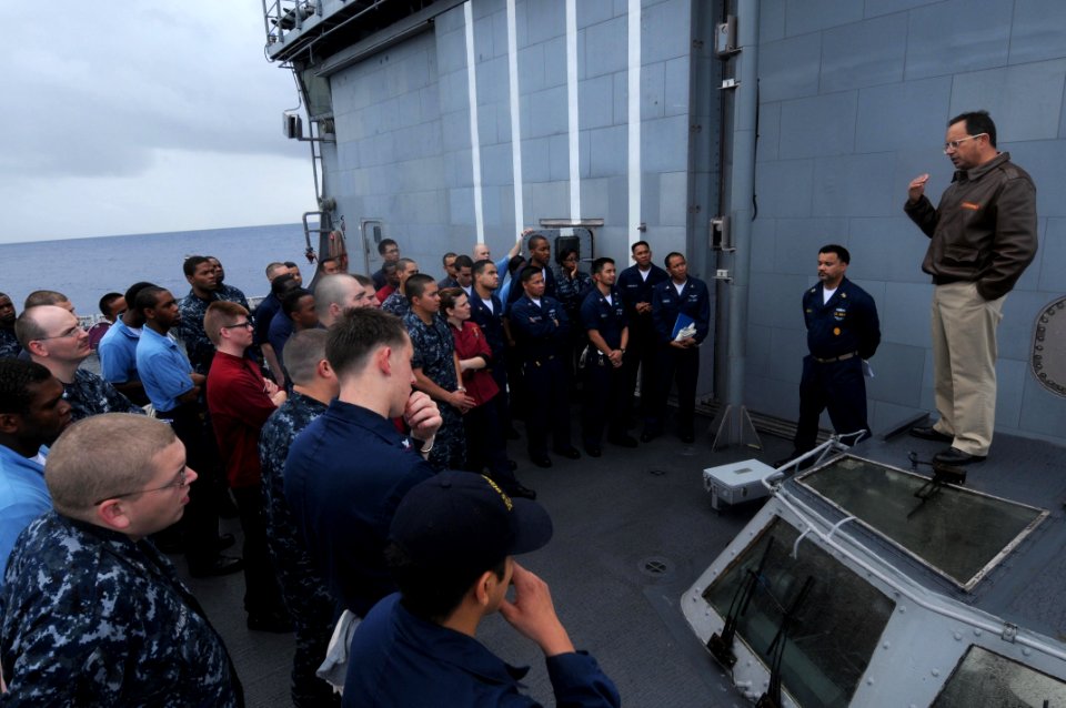US Navy 100217-N-4275C-030 Capt. Dominic DeScisciolo, commanding officer of the guided-missile cruiser USS Bunker Hill (CG 52), speaks to the supply department regarding the team's recent work and tasks