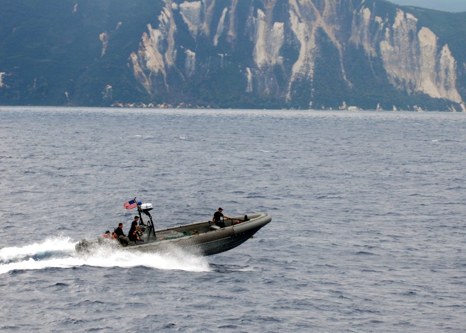 US Navy 100218-N-2000D-011 ailors assigned to the amphibious dock landing ship USS Carter Hall (LSD 50) transport passengers from Carter Hall to the amphibious assault ship USS Bataan (LHD 5)