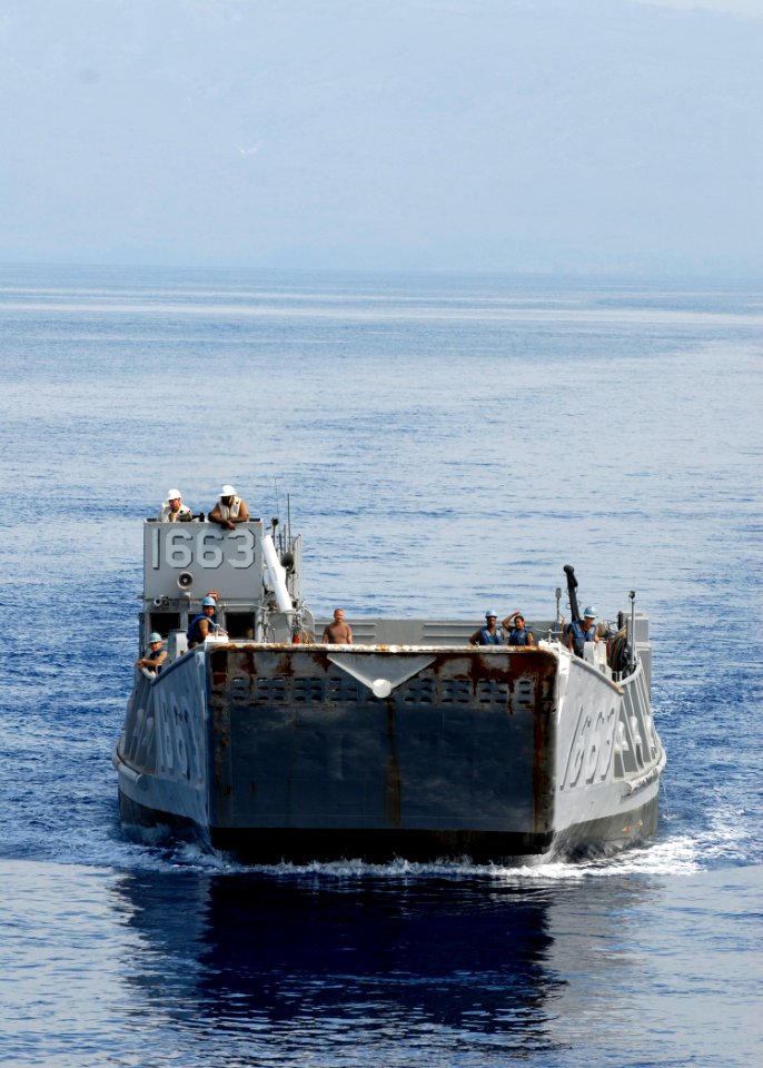 US Navy 100215-N-2000D-179 Landing Craft Utility (LCU) 1663, assigned to Assault Craft Unit (ACU) 2, approaches the well deck of the amphibious dock landing ship USS Carter Hall (LSD 50) during wet well operations in the Caribb