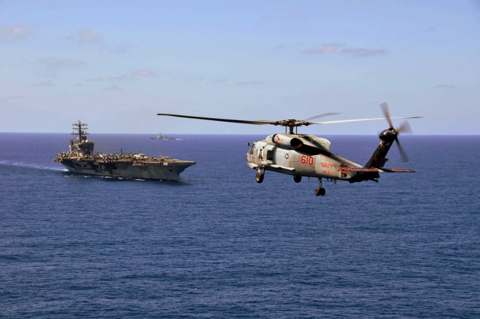 US Navy 100215-N-8421M-014 An SH-60F Sea Hawk helicopter assigned to the Indians of Helicopter Anti-Submarine Squadron (HS) 6 approaches the aircraft carrier USS Nimitz (CVN 68)