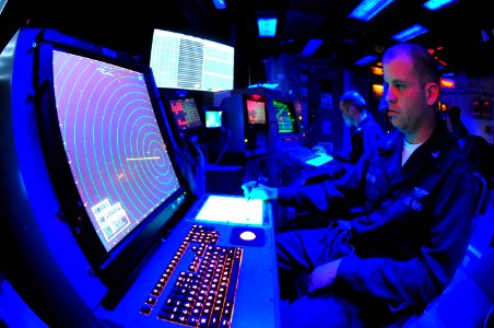 US Navy 100219-N-2953W-060 Air Traffic Controller 3rd Class James Boutin stands the approach control watch in the carrier air traffic control center aboard USS Carl Vinson (CVN 70)