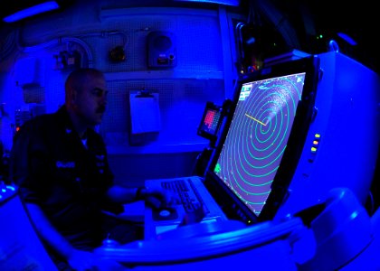 US Navy 100219-N-2953W-147 Air Traffic Controller 1st Class Dustin Gallagher reads the radar in the carrier air traffic control center aboard USS Carl Vinson (CVN 70)