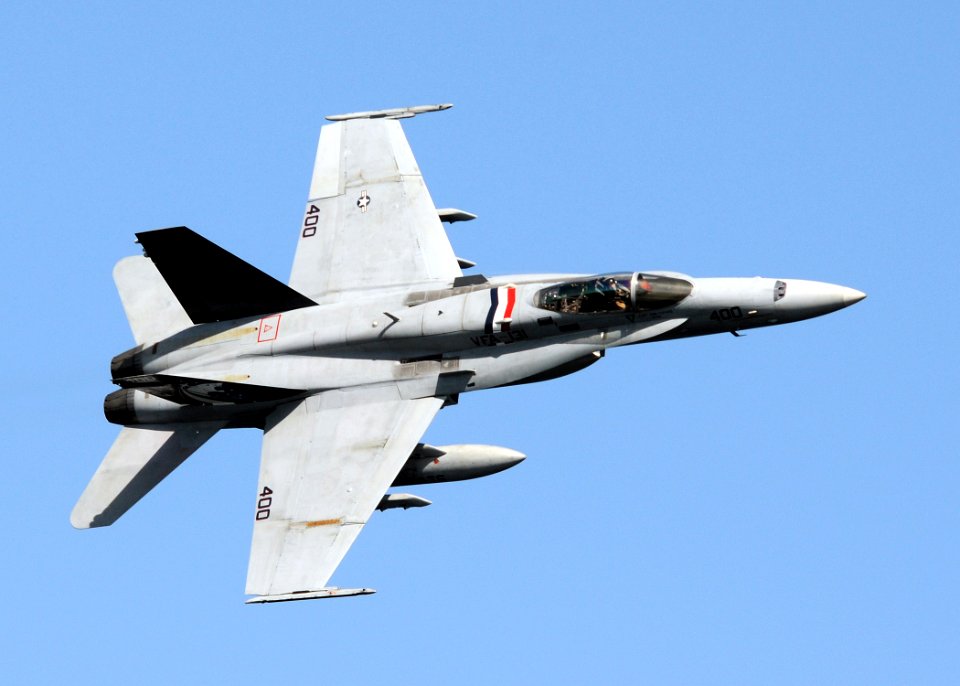 US Navy 100216-N-4236E-325 Cmdr. Thomas Bush, commanding officer of Strike Fighter Squadron (VFA) 131, executes a high-speed fly-by in an F-A-18C Hornet