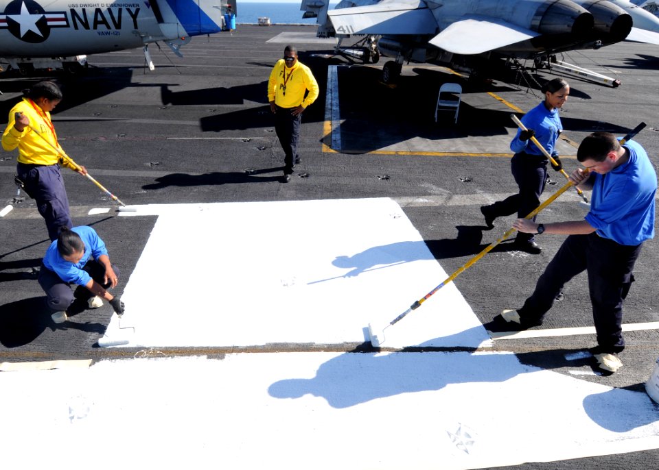 US Navy 100219-N-4236E-098 Aviation boatswain's mates paint the flight deck during a no-fly-day aboard the Nimitz-class aircraft carrier USS Dwight D. Eisenhower (CVN 69)