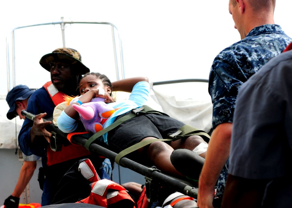 US Navy 100215-N-4378P-110 Patients are transported from USNS Comfort