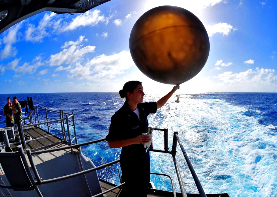US Navy 100219-N-2953W-260 erographer's Mate 2nd Class Elizabeth Clements prepares to release a weather balloon from the fantail of USS Carl Vinson (CVN 70)
