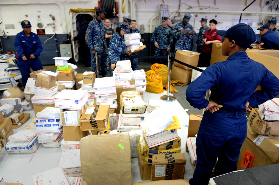 USS America mail call 140824-N-LD343-001
