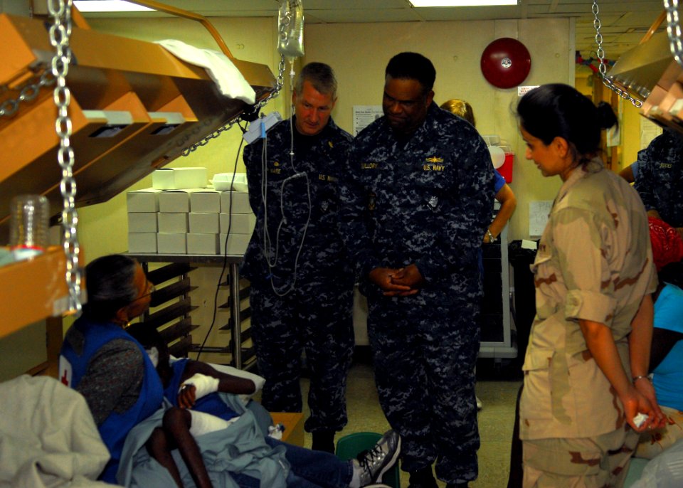 US Navy 100217-N-1092P-080 Rear Adm. Victor G. Guillory, commander, U.S. Naval Forces Southern Command, speaks with Haitian patients receiving medical care aboard the Military Sealift Command hospital ship USNS Comfort (T-AH 2