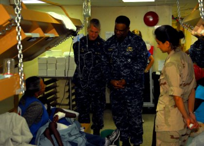 US Navy 100217-N-1092P-080 Rear Adm. Victor G. Guillory, commander, U.S. Naval Forces Southern Command, speaks with Haitian patients receiving medical care aboard the Military Sealift Command hospital ship USNS Comfort (T-AH 2 photo