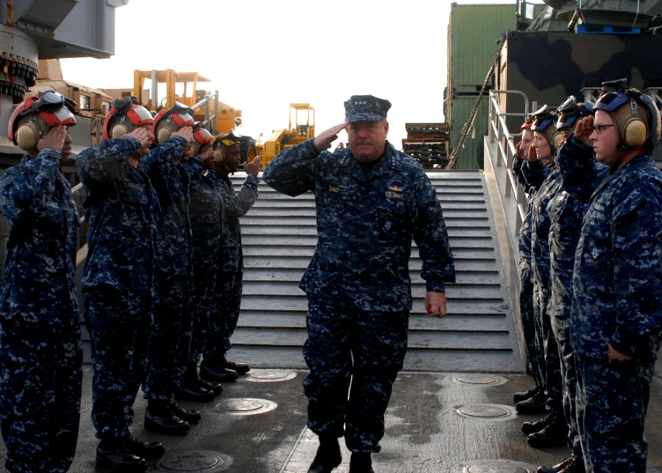 US Navy 100217-N-2000D-035 Vice Adm. Peter H. Daly, deputy commander of U.S. Fleet Forces Command, walks through sideboys aboard the amphibious dock landing ship USS Carter Hall (LSD 50) during a ship's visit