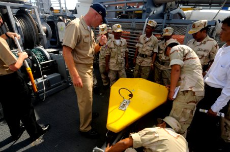 US Navy 100216-N-8335D-113 hief Mineman William Brown shows Royal Cambodian Navy officers a Klein side-scan sonar aboard the mine counter-measures ship USS Patriot (MCM 7)