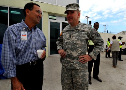 US Navy 100219-N-5961C-008 Art Torno, left, American Airlines Regional Director for the Caribbean, speaks with Gen. Ken Keene, commanding general of Operation Unified Response, at Toussaint Louverture International Airport in