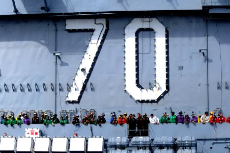 US Navy 100218-N-4275C-003 Flight deck personnel aboard SS Carl Vinson (CVN 70) observe USS Bunker Hill (CG 52) during a leapfrog positioning exercise
