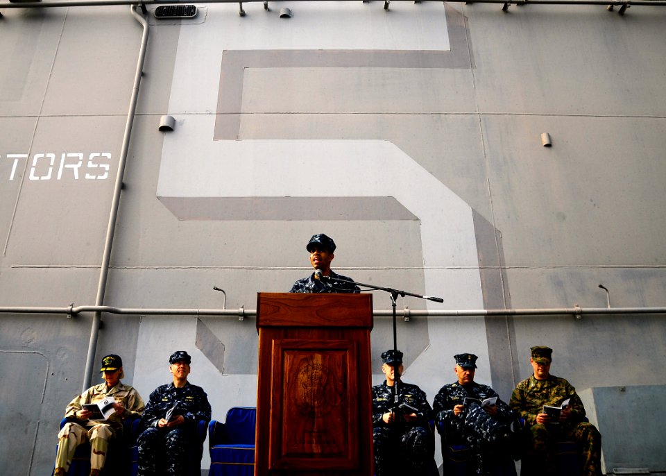 US Navy 100219-N-8655E-087 Capt. Sam Howard speaks to the crew of USS Bataan (LHD 5) during a change of command ceremony