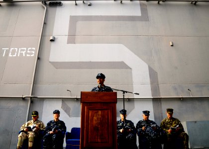 US Navy 100219-N-8655E-087 Capt. Sam Howard speaks to the crew of USS Bataan (LHD 5) during a change of command ceremony
