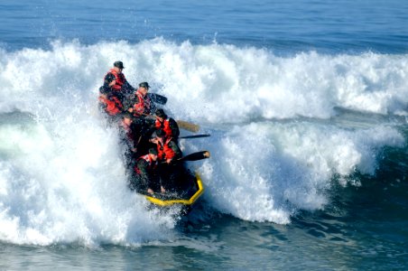 US Navy 100216-N-7883G-139 Basic Underwater Demolition-SEAL (BUDs) students participate in Surf Passage at Naval Amphibious Base Coronado photo