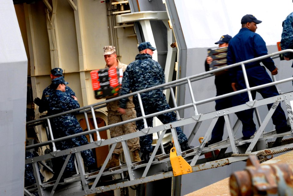 US Navy 100218-N-3358S-095 Marines and Sailors aboard USS Mesa Verde (LPD 19) load supplies during an all-hands working party