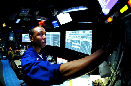 US Navy 100219-N-2953W-162 Air Traffic Controller 2nd Class Alexander Allen stands plotter watch in the carrier air traffic control center aboard USS Carl Vinson (CVN 70)