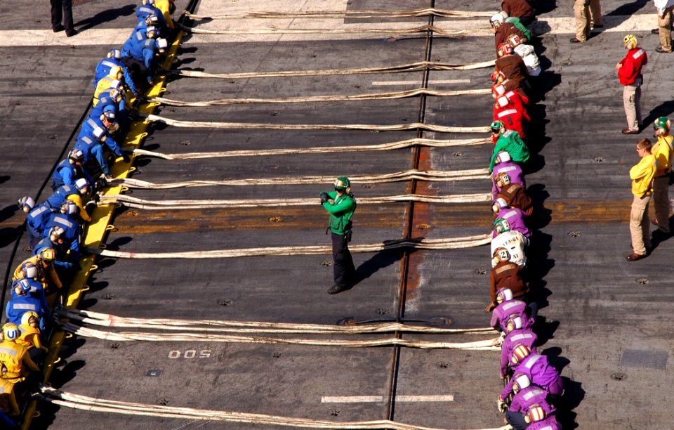 US Navy 100218-N-8822R-209 Aviation Boatswain's Mates assigned to the air department of the aircraft carrier USS Carl Vinson (CVN 70) conduct an aircraft barricade drill
