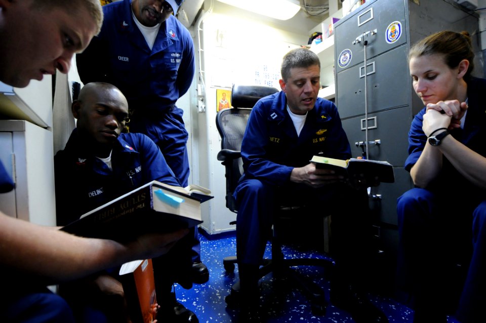 US Navy 100221-N-1688B-099 Lt. Peter Dietz leads a prayer during a Lenten prayer service aboard the guided-missile cruiser USS Hue City (CG 66)