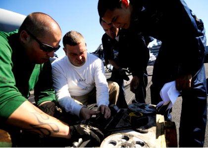 US Navy 100219-N-6854D-048 Sailors replace the drive system on a catapult