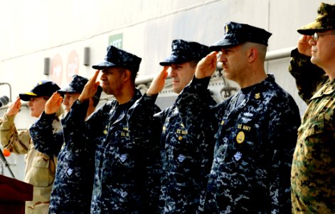 US Navy 100219-N-7508R-212 The official party salutes the colors during a change of command ceremony aboard USS Bataan (LHD 5)