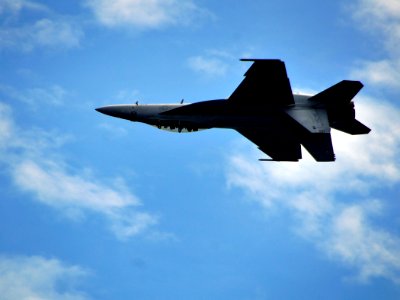 US Navy 100222-N-4774B-019 An F-A-18 Super Hornet assigned to the Sunliners of Strike Fighter Squadron (VFA) 81 flies upside down past the Nimitz-class aircraft carrier USS Carl Vinson (CVN 70) during a flight demonstration