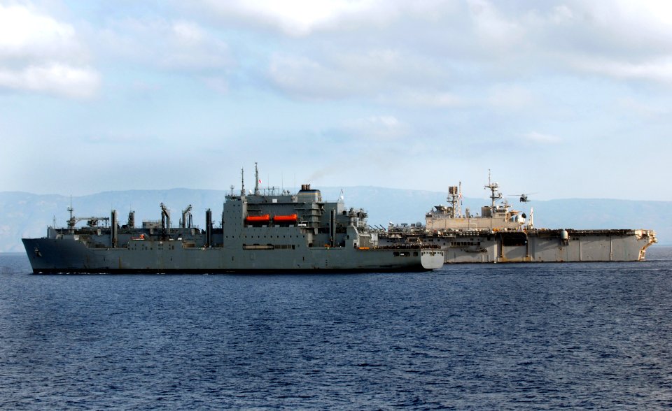 US Navy 100220-N-2000D-017 The Military Sealift Command dry cargo and ammunition ship USNS Sacagawea (T-AKE-2) and the multipurpose amphibious assault ship USS Bataan (LHD 5) conduct a vertical replenishment