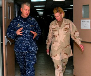 US Navy 100220-N-4047W-065 Capt. James Ware, commanding officer of the Medical Treatment Facility aboard the Military Sealift Command hospital ship USNS Comfort (T-AH 20), discusses medical efforts