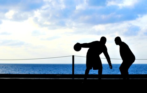 US Navy 100221-N-3595W-003 Sailors play basketball in the hangar bay of the Nimitz-class aircraft carrier USS Dwight D. Eisenhower (CVN 69)
