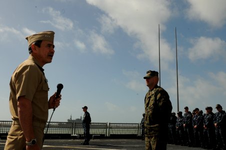 US Navy 100223-N-6676S-069 Vice Adm. Harry Harris, commander of the U.S. 6th Fleet, addresses Sailors, Marines, and international staff aboard the amphibious transport dock ship USS Gunston Hall (LSD 44) photo