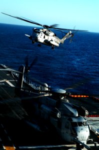 US Navy 100222-N-1226D-233 Two CH-53E Sea Stallion helicopters assigned to Marine Medium Helicopter Squadron 165 (REIN) land during flight operations aboard the amphibious assault ship USS Peleliu (LHA 5)
