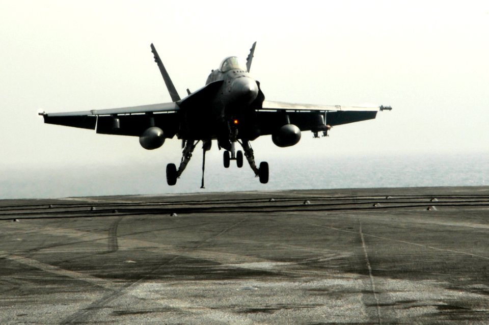 US Navy 100222-N-3038W-075 An F-A-18C Hornet assigned to the Sidewinders of Strike Fighter Squadron (VFA) 86 lands aboard the aircraft carrier USS Nimitz (CVN 68)