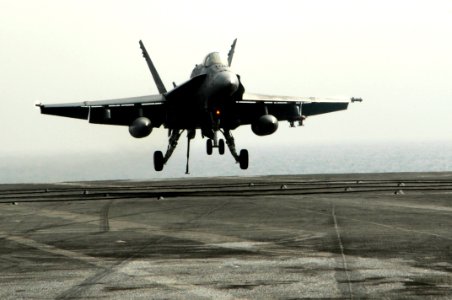 US Navy 100222-N-3038W-075 An F-A-18C Hornet assigned to the Sidewinders of Strike Fighter Squadron (VFA) 86 lands aboard the aircraft carrier USS Nimitz (CVN 68)