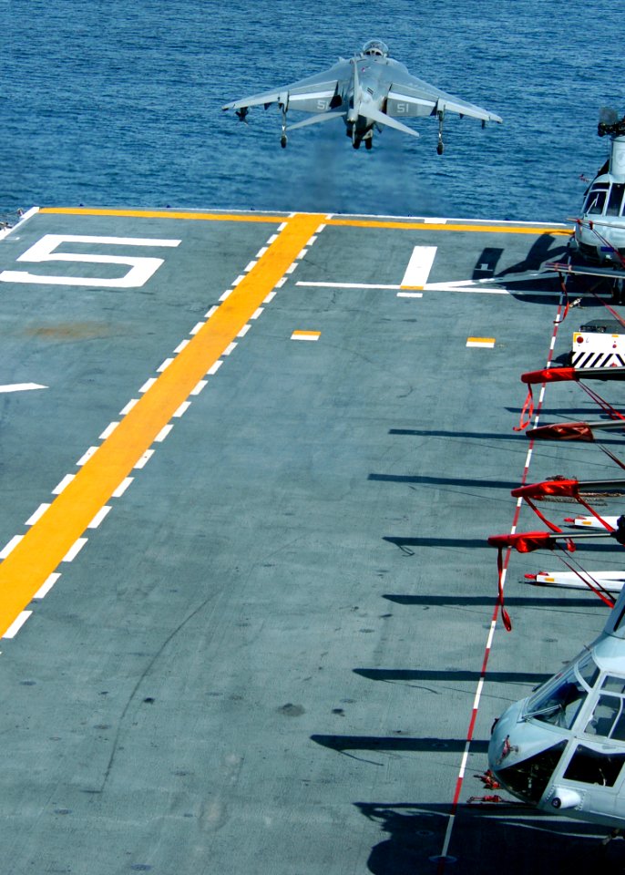 US Navy 100223-N-7948R-002 An AV-8B Harrier launches off from the amphibious assault ship USS Peleliu (LHA 5) while conducting flight deck operations