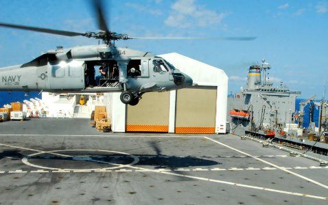 US Navy 100222-N-4047W-190 An MH-60S Sea Hawk helicopter assigned to Helicopter Sea Combat Squadron (HSC) 28 lands aboard the Military Sealift Command hospital ship USNS Comfort (T-AH 20) photo